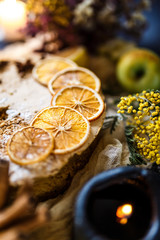 Biscuit apple pie with cinnamon, citron, oriental spices and sugar powder on dark background