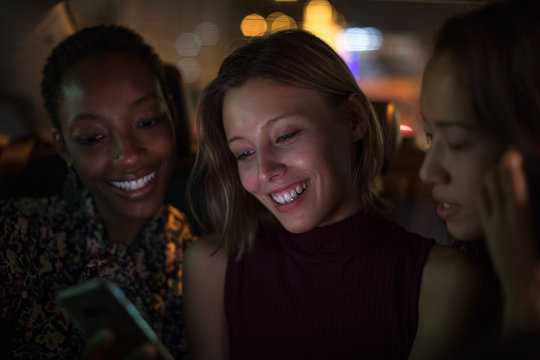 Three girls in a taxi together