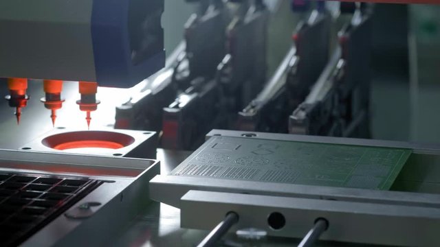 Electronic circuit board production. Automated Circut Board machine Produces Printed digital electronic board. Electronics contract manufacturing. Manufacture of electronic chips. High-tech.