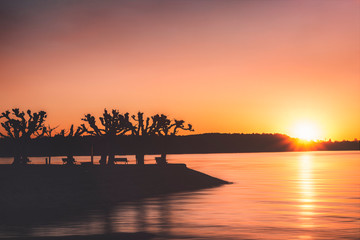 Sunset over water. Summer vacation background.