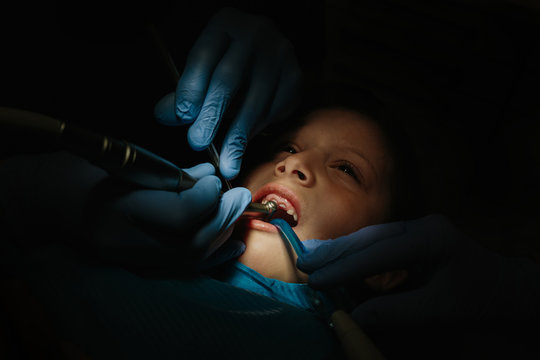 Dentist working on child teeth