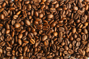 coffee beans (good and bad grain) - arabica and robusta blend (roasted coffee grain). Black background. Top view . Copy space