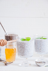 Chia seeds yogurt pudding with honey in glasses for breakfast