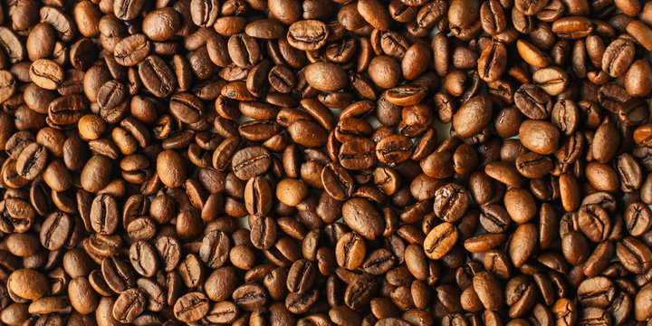 coffee beans (good and bad grain) - arabica and robusta blend (roasted coffee grain). Black background. Top view . Copy space