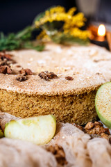 Biscuit apple pie with cinnamon, citron, oriental spices and sugar powder on dark background