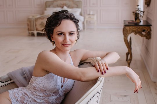 Portrait of bride in lingerie in her bedroom