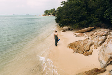 Woman walking on a beautiful beach