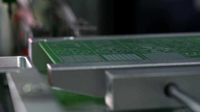 Electronic circuit board production. Automated Circut Board machine Produces Printed digital electronic board. Electronics contract manufacturing. Manufacture of electronic chips. High-tech.