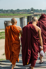 Monks are wolking on U-Bein bridge, Myanmar