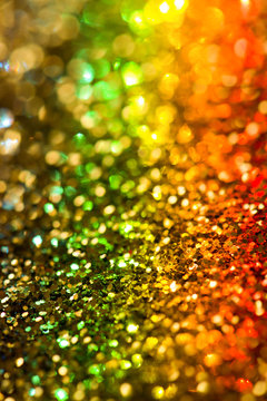 Golden glitter with a prism of light