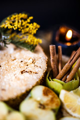 Biscuit apple pie with cinnamon, citron, oriental spices and sugar powder on dark background