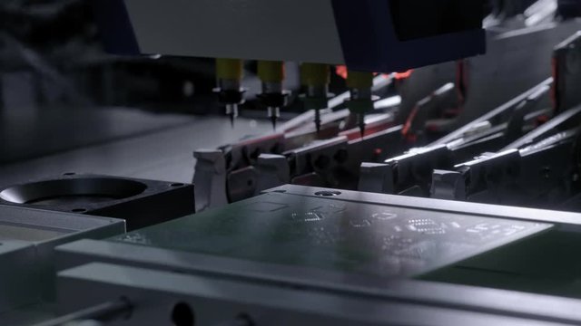 Electronic circuit board production. Automated Circut Board machine Produces Printed digital electronic board. Electronics contract manufacturing. Manufacture of electronic chips. High-tech.
