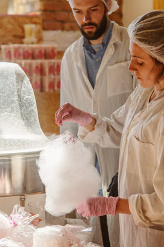 Confectioners dusting cotton candy