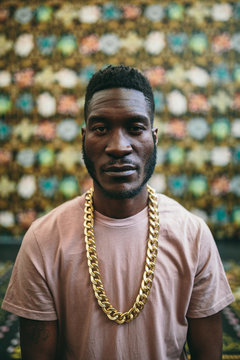 Black serious man looking at camera