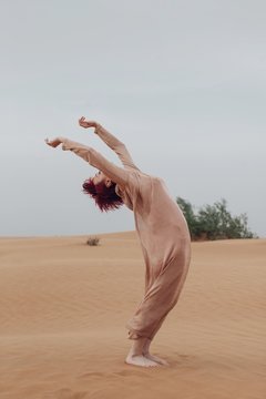 Emotional portrait of woman in desert