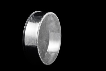 Sieve for sifting flour on a black background, isolate