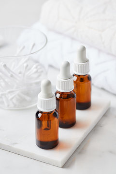 Three bottles of essential oils in row.