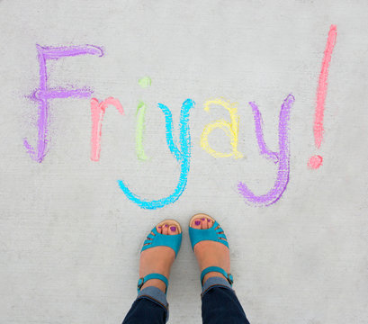 Feet and the chalk word Fri-Yay!