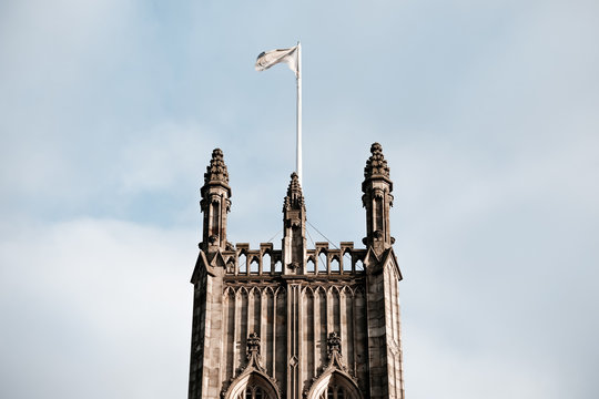 gothic tower  with  flag on the top