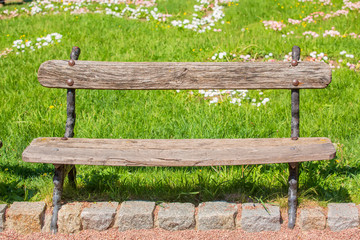 Naklejka premium Old bench in the park. May 24 is European Parks Day
