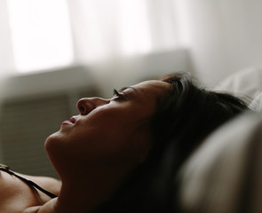 closeup of real woman on the bed