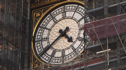 Close up footage of Big Ben's big clock under renovation.