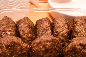 Grilled steaks in a glass plate. Juicy cutlets