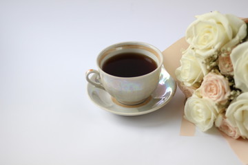 cup of coffee and wedding bouquet