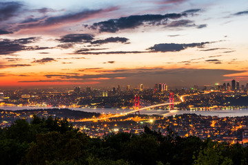 Istanbul Bosphorus Bridge at sunset. 15th July Martyrs Bridge. Night view from Camlica Hill. Istanbul, Turkey..