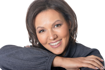 Studio portrait of beautiful brunette woman on white background