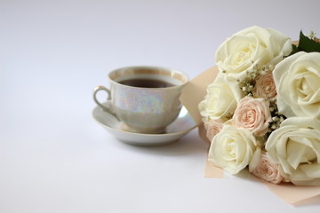 Obraz na płótnie Canvas cup of coffee and wedding bouquet