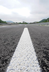 Modern highway safety markings on tarmac