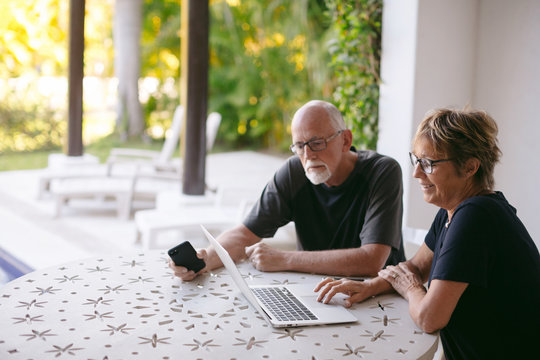 Couple using technolgy at home
