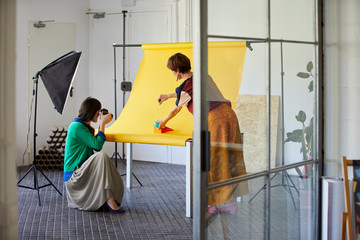 Professional With Colleague Photographing Objects
