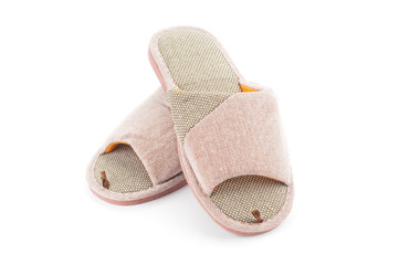 Pair of home slippers close up isolated on white background