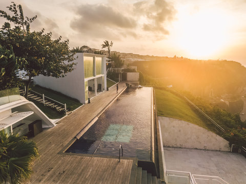 aerial view of modern luxury villa with huge swimming pool