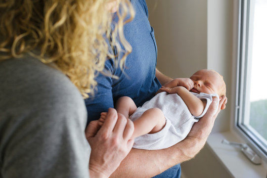 Man and woman with newborn baby.