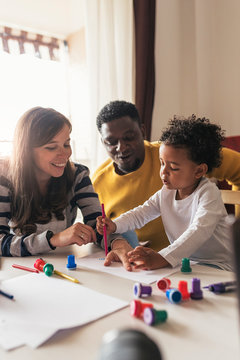 Happy family drawing at home