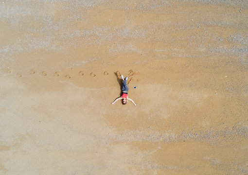 Woman lying on a beach