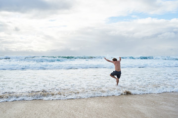 Aussie traveler go swimming to the beach in winter.
