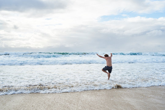 Aussie traveler go swimming to the beach in winter.