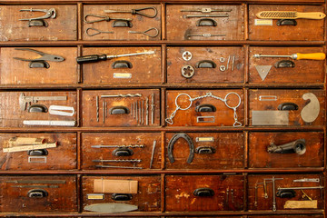 A detail of an old cupboard with drawers, part of the old vintage ironmongery. 