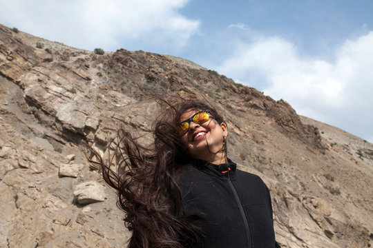 Hair of a happy moment blowing with strong wind
