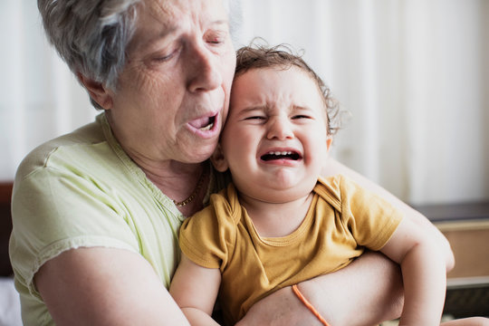 Grandmother With Her Grandson At Home