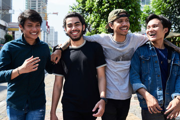 Group of friends spending time together in the city. Asian.