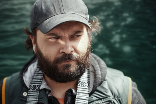 Globe trotting man at the lake