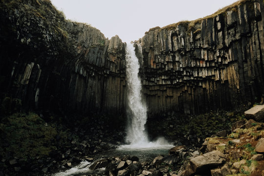 Waterfall and hexagonal rock