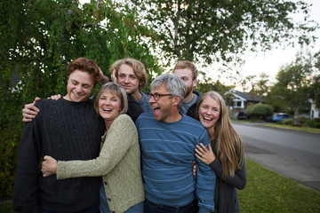 Fun family with grown up kids outside together