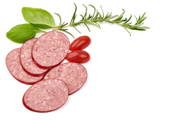 Sliced dry salami sausage with basil leaves, top view, isolated on white background