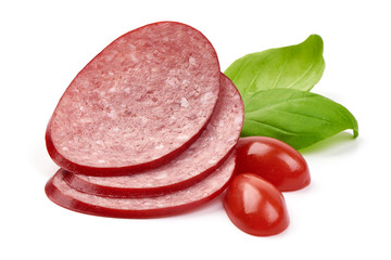 Sliced dry salami sausage with basil leaves, close-up, isolated on white background